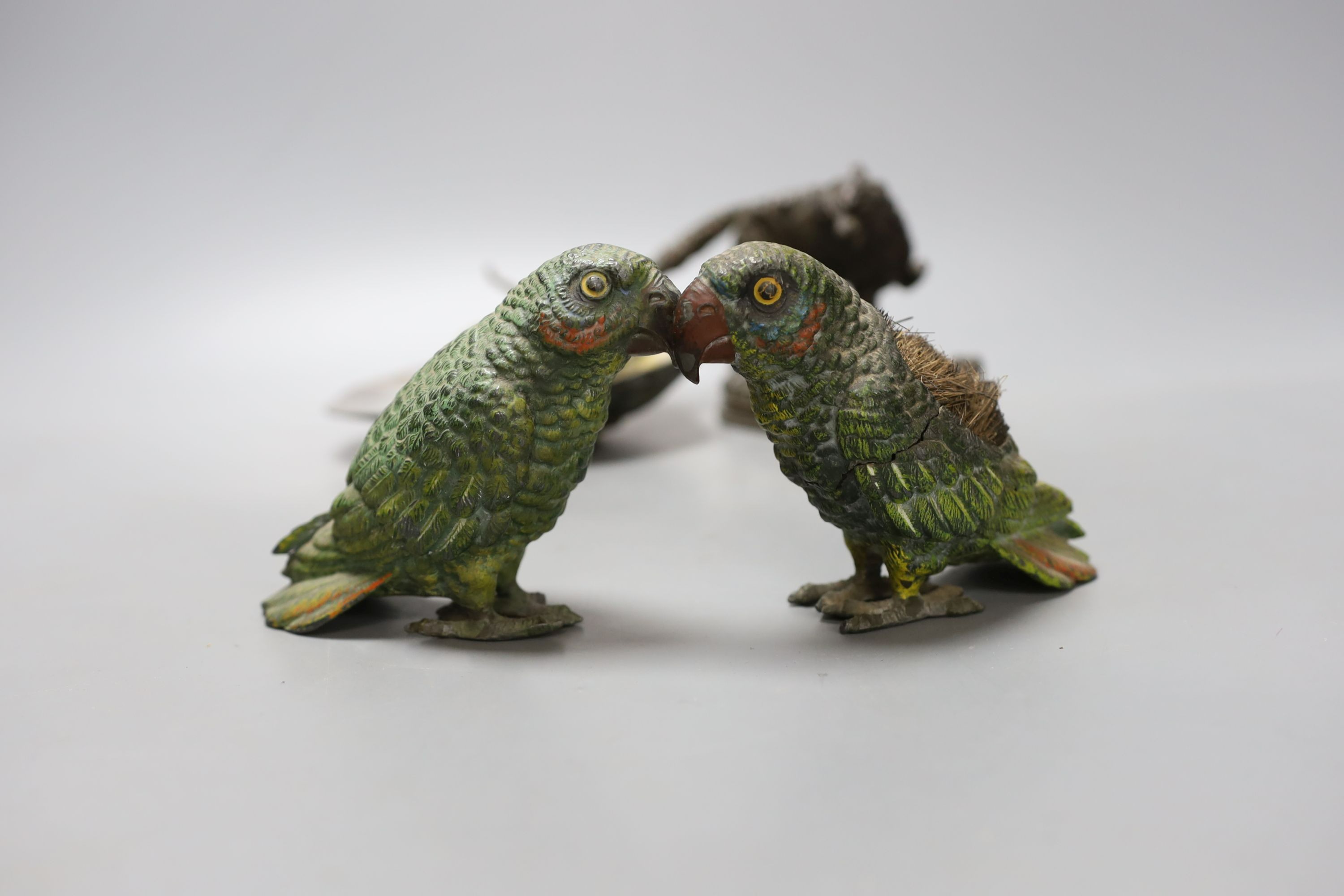 A bronze and mother-of-pearl 'lizard' dish, a bronzed spelter fox, 15cm long and two cold painted spelter parrots